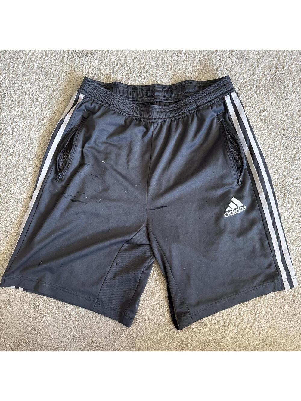 Adidas grey shorts with white stripes  on side